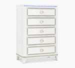 White dresser with silver embellishments on a white background