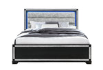 Bed with gray upholstered headboard and black frame on a white background