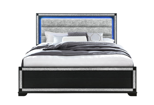 Bed with gray upholstered headboard and black frame on a white background