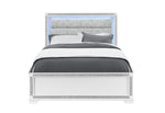 Bed with gray bedding and decorative headboard on a white background