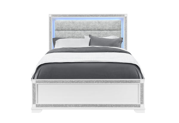 Bed with gray bedding and decorative headboard on a white background