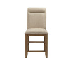 Beige upholstered chair with wooden legs on a white background