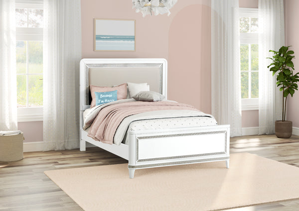 White bed frame with pink bedding in a bedroom with pink walls and large windows.