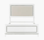 White bed with silver frame and mirror on a white background